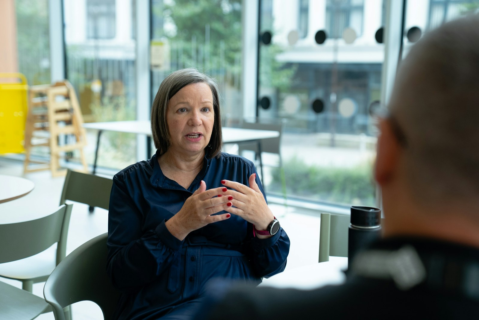 Two people in a focused research conversation